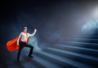 Fototapeta premium Superman on ladder
