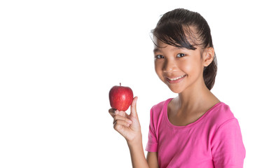 Young Asian Malay teenager with a red apple