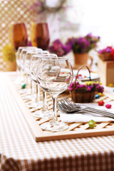Buffet table with dishware waiting for guests