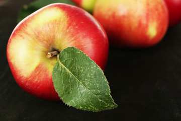 Ripe apples on wooden background