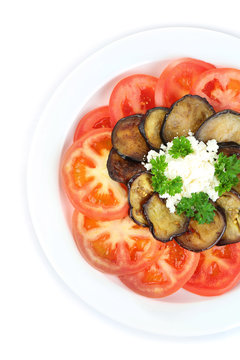 Eggplant salad with tomatoes and feta cheese, isolated on white