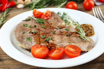 Delicious grilled meat on table