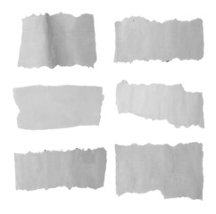 Six torn paper pieces isolated on white
