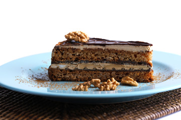 Delicious chocolate cake on plate on table close-up