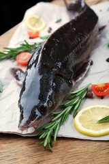 Fresh raw fish and food ingredients on table