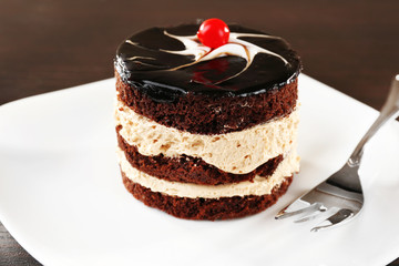 Yummy chocolate cupcake on table, close-up