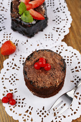 Yummy chocolate cupcake on table, close-up