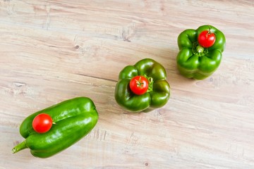 Fresh green peppers and small tomatoes diagonal row