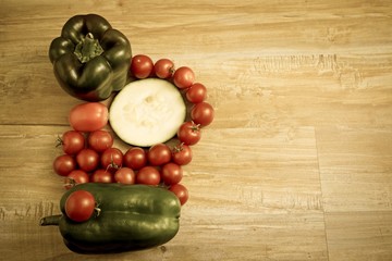 Fresh vegetables at wooden background. Horizontal vintage image