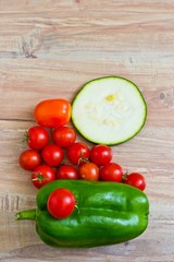 Fresh vegetables at wooden background