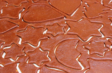 Dough for cookies in shape of star and heart