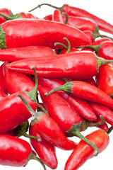 pods of fresh red chili peppers close up