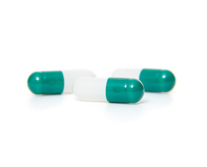 Detail shot of pills on white background.