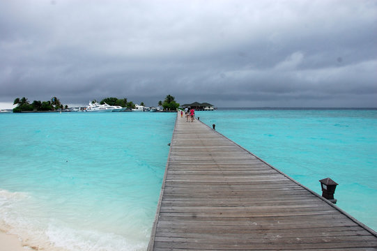 Long timber pier at Paradise Island Resort Maldives