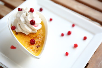 Creme brulee. Traditional French vanilla cream dessert with frui