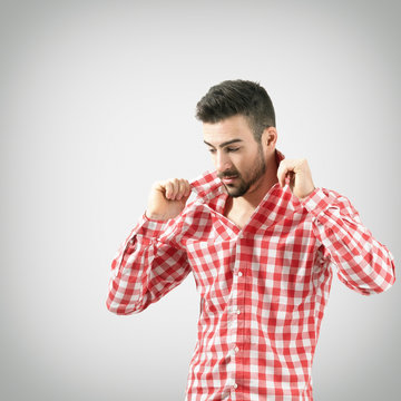 Portrait Of Man Adjusting Turned Up Shirt Collar