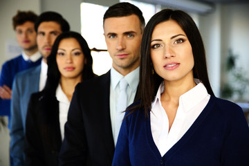 Group of a business people standing lined up in the office