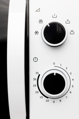 Close up of modern microwave control panel, blue light