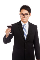 Asian businessman with glass of red wine