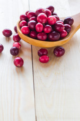 Cranberries wooden spoon background berry