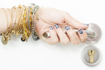 a women open a door with jewels