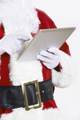 Close Up Of Santa Claus Using Digital Tablet On White Background