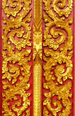 Door wood carving in temple, Thailand