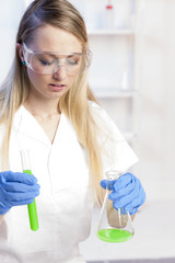 young woman doing experiment in laboratory