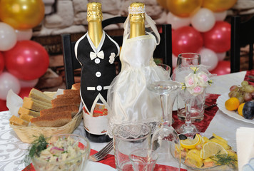 Two bottles of Champaign decorated as newly-married