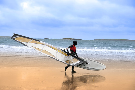 lone wild Atlantic way windsurfer getting ready to surf