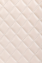 Milky white quilted leather background