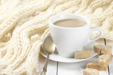 Coffee with cookies and knitwear