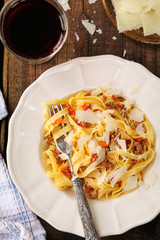 Italian tagliatelle pasta with Bolognese sauce and parmesan