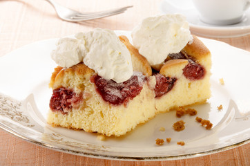 cake with strawberry filling and whipped cream