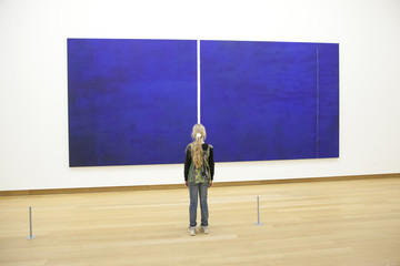 young girl in Stedelijk museum before painring of Barnett Newman