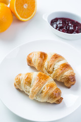 delicious breakfast with croissants and juice