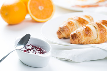 delicious breakfast with croissants and juice