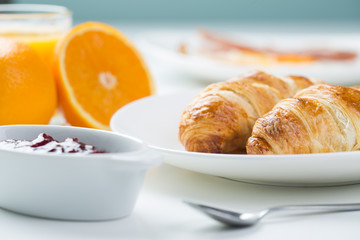 delicious breakfast with croissants and juice