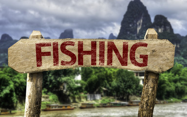 Fishing sign with a forest background