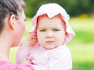 Adorable baby with her mother