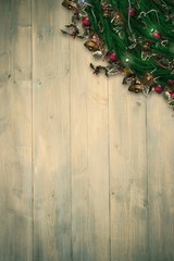 Composite image of festive christmas wreath with decorations