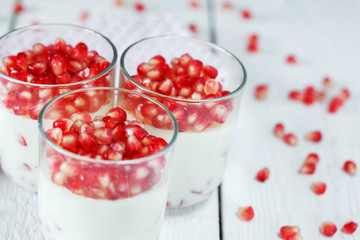 closeup Delicious dessert with fresh pomegranate seeds in a glas