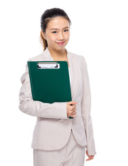 Young businesswoman with clipboard