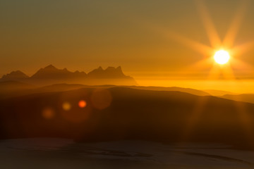 Sunset, with mountain scenery and lens reflex