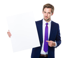 Businessman finger point to white board