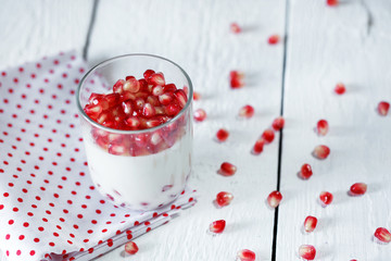 Jelly gelatin cream dessert or panna cotta with pomegranate seed