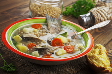 Homemade soup of river fish in the bowl