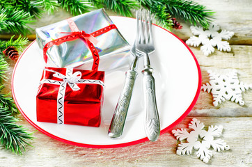Christmas background with gifts on plate