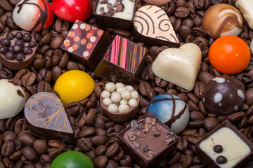 Set of a various chocolate pralines and coffee beans