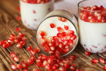 closeup Delicious dessert with fresh pomegranate seeds in a glas